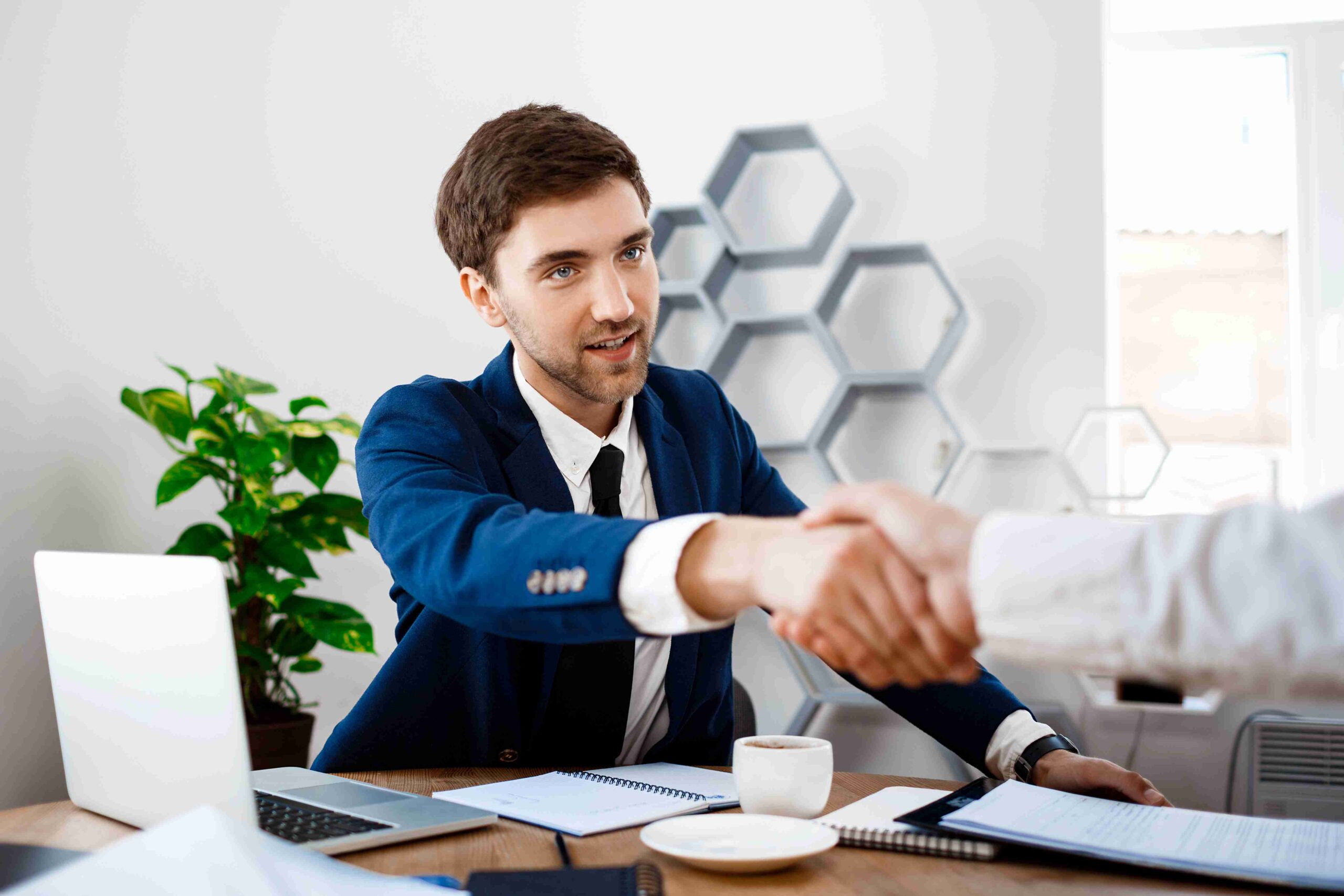 young-successful-businessman-sitting-workplace-office image